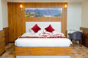 Voodi või voodid majutusasutuse Hotel Palazzo toas