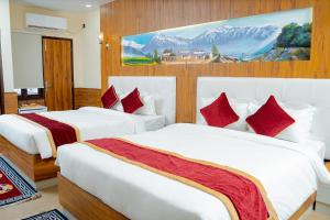 Voodi või voodid majutusasutuse Hotel Palazzo toas