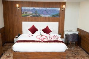 Voodi või voodid majutusasutuse Hotel Palazzo toas