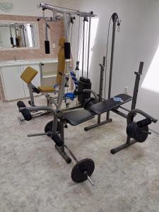 a gym with several exercise equipment in a room at Ubytování u Jany in Hluboká nad Vltavou