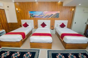 Voodi või voodid majutusasutuse Hotel Palazzo toas