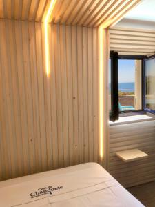 a room with a bed and a window at Casa de Chanquete in Viana do Castelo