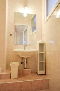 a bathroom with a sink and a mirror at Villa Chingo in Ohrid +30 photos