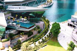an aerial view of a building next to the water at Songs of the Lake by Lagom - Bonnington Apartment Jumeirah Lake Towers, in Dubai
