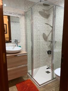 a bathroom with a shower and a sink at Encanto Natural de Arinaga in Arinaga