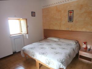 Łóżko lub łóżka w pokoju w obiekcie Agriturismo La Part