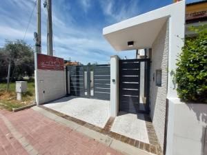 a gate to a building with a fence at Residenza Elba - Charme House in Termoli