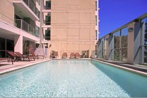 a swimming pool in front of a building at Emerald Gem 2bedroom 2bath With Full Marina View in Los Angeles