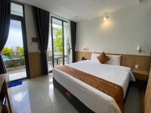 Postel nebo postele na pokoji v ubytování Ngoc Trai Xanh Bungalow + 37 fotografií
