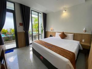 Кровать или кровати в номере Ngoc Trai Xanh Bungalow