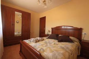 a bedroom with a bed with two pillows on it at La Resbalina de Arribes in Trabanca