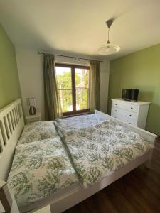 Postel nebo postele na pokoji v ubytování Apartment Gemer & Apartment Volovec
