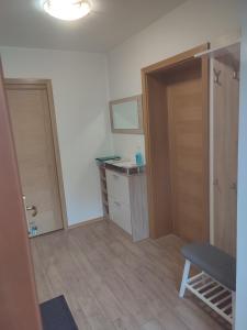 an empty room with a door and a desk at Počitniško stanovanje Aurora in Bovec