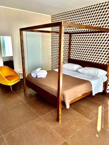 a bedroom with two bunk beds and a mirror at TorreNormanna Prestige House near Cefalù in Mandra Capreria