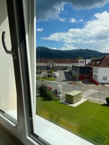 a view from a window of a parking lot at Sofia Apartment & Zimmer Nähe Redbull Ring in Knittelfeld
