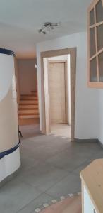 a room with a door leading to a garage at Casa vacanze Maria in Tesero