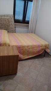מיטה או מיטות בחדר ב-casa vacanza Green House Casalvelino