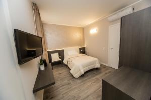 TV a/nebo společenská místnost v ubytování B&B Corte sul Naviglio CIN I T 0 1 5 0 7 0 C 1 3 X U I L Q C V
