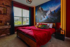 a bedroom with a superhero poster on the wall at Thematic Home with Pool Spa and Game room! in Kissimmee