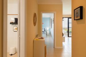 a room with a refrigerator and a hallway at Tyler's House Ocean View in Costa Teguise