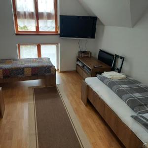 Postel nebo postele na pokoji v ubytování Petra Vendégház
