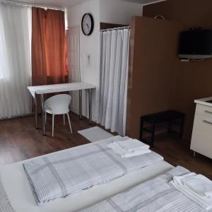 Postel nebo postele na pokoji v ubytování Petra Vendégház