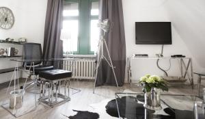 TV a/nebo společenská místnost v ubytování Höhen Hotel Viersen