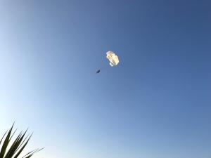a kite is flying in the blue sky at Modern Apartment for 4 persons, Sea view, near the beach in Supetar