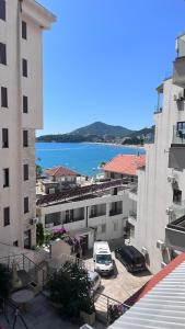a car parked in a parking lot next to buildings at Apartment Crocus of Rafailovici in Budva