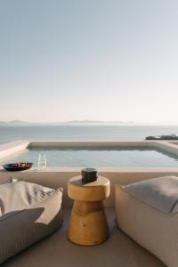 a living room with a view of the ocean at Bard De Sol in Mýkonos City