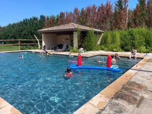 a group of people playing in a swimming pool at Relais DAIA 
