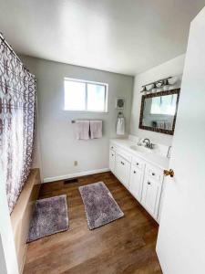 a bathroom with a sink and a mirror at Retreat Home Near Yosemite and Bass Lake! in Oakhurst