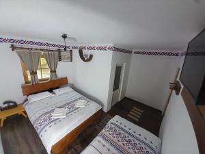 Postel nebo postele na pokoji v ubytování Mosia Dar In Rai