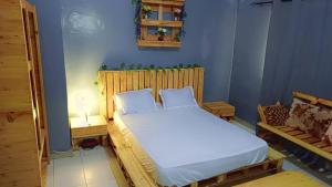 Ένα ή περισσότερα κρεβάτια σε δωμάτιο στο Chambre meublée climatisé