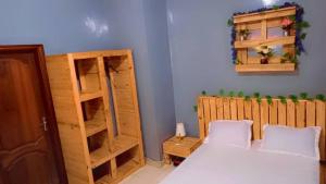 Ένα ή περισσότερα κρεβάτια σε δωμάτιο στο Chambre meublée climatisé