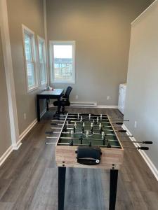 a room with a table with a chess board at Spacious 3 Bedroom Home in Martinsburg WV. in Martinsburg