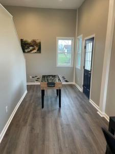 an empty room with a table in the middle of it at Spacious 3 Bedroom Home in Martinsburg WV. in Martinsburg