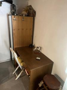 a wooden desk in a room with a chair at Holiday home Stiniva in Vis