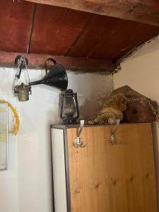 a tea kettle on top of a refrigerator at Holiday home Stiniva in Vis