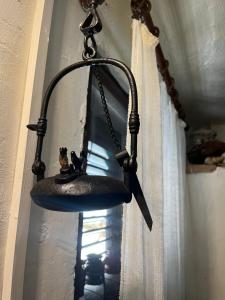 a bell hanging from a wall in a room at Holiday home Stiniva in Vis