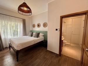 Postel nebo postele na pokoji v ubytování Brubru Lodge