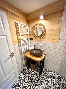 a bathroom with a sink and a mirror at Victoria Gasthaus Rasnov - charming vacation house in Rasnov in Râşnov