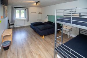 מיטה או מיטות קומותיים בחדר ב-Bed and Breakfast Lemvig