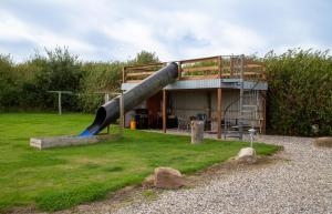 a large slide in front of a building at Bed and Breakfast Lemvig in Lemvig