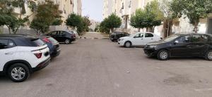 a bunch of cars parked in a parking lot at Appartement Fès in Fez