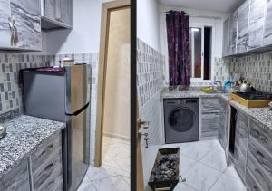a kitchen with a refrigerator and a washing machine at Appart de vacance à Bouznika in Bouznika