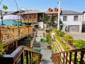 a balcony with a garden of flowers and plants at Old Rabati in Akhaltsikhe