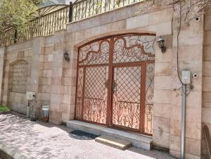 an iron gate on the side of a building at Villa Marmara in Medina