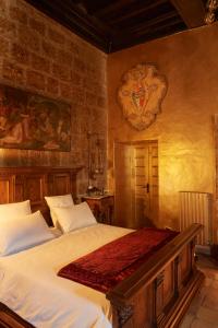 Postel nebo postele na pokoji v ubytování Palazzo storico Colesanti
