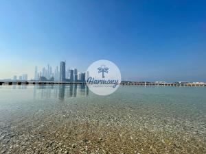 a view of the city of dubai from the water at Harmony Vacation Homes - South Residence in Dubai